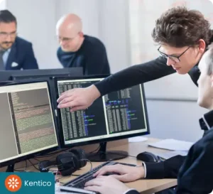 Kentico software developer coding on computer building scalable web and custom software solutions