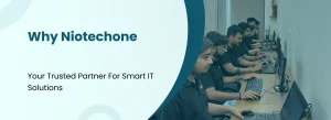 NiotechOne developers working on computers – delivering smart and scalable IT solutions.