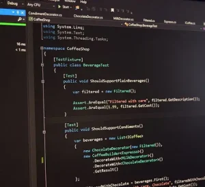 Developer writing code on a computer screen with programming environment visible