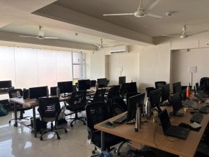 Modern IT office with multiple developer workstations