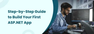 Step-by-step guide to build your first ASP.NET app with a developer coding on a computer